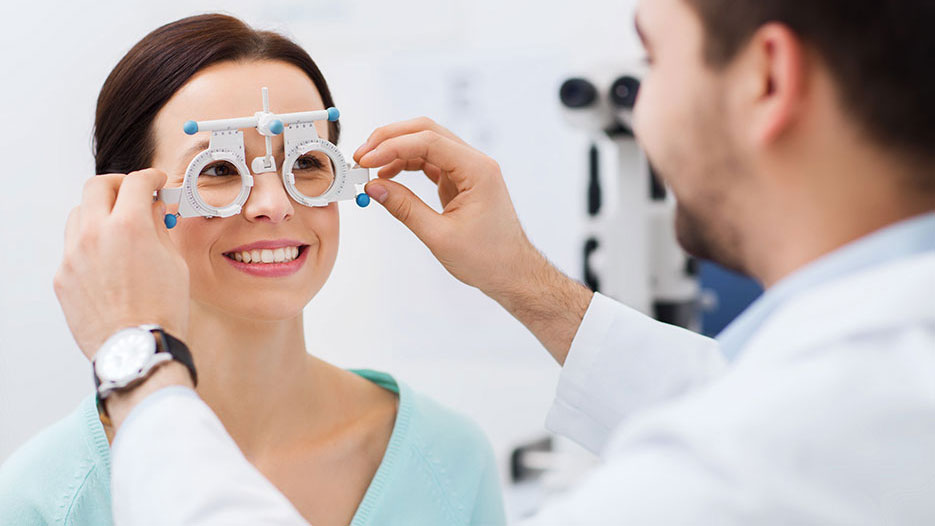 Technician administering eye exam