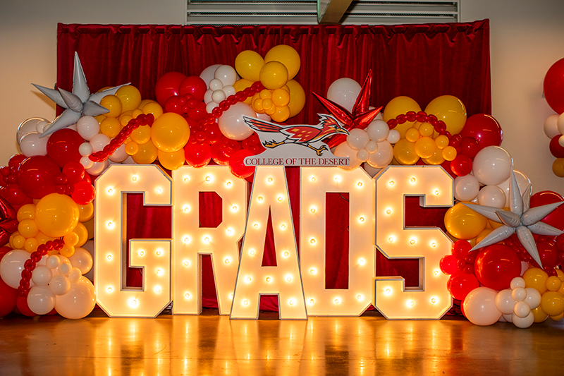 College of the Desert Glowing Grads Sign